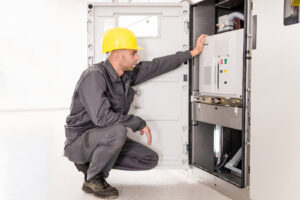 Two Engineers Dealing With The Electricity Transformer